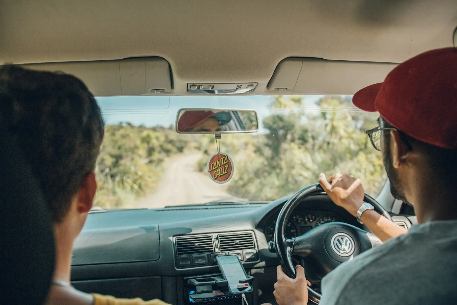 A parent in the passenger seat while a teen drives