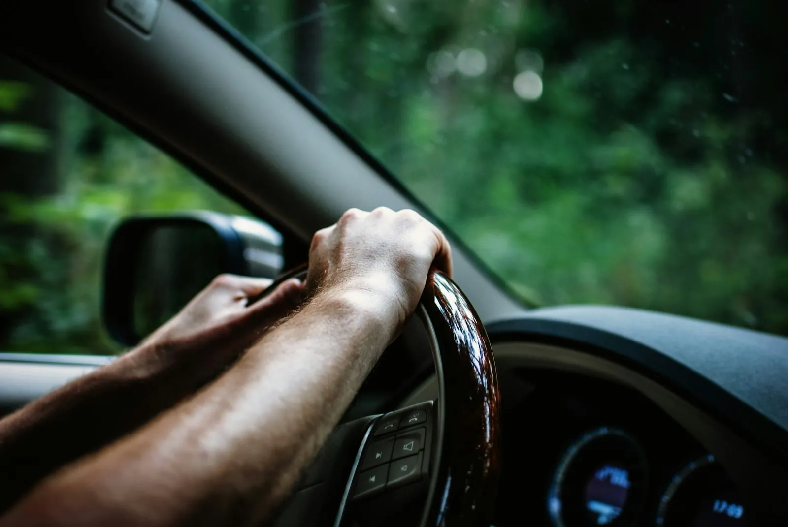A phone put away face down while a teen drives