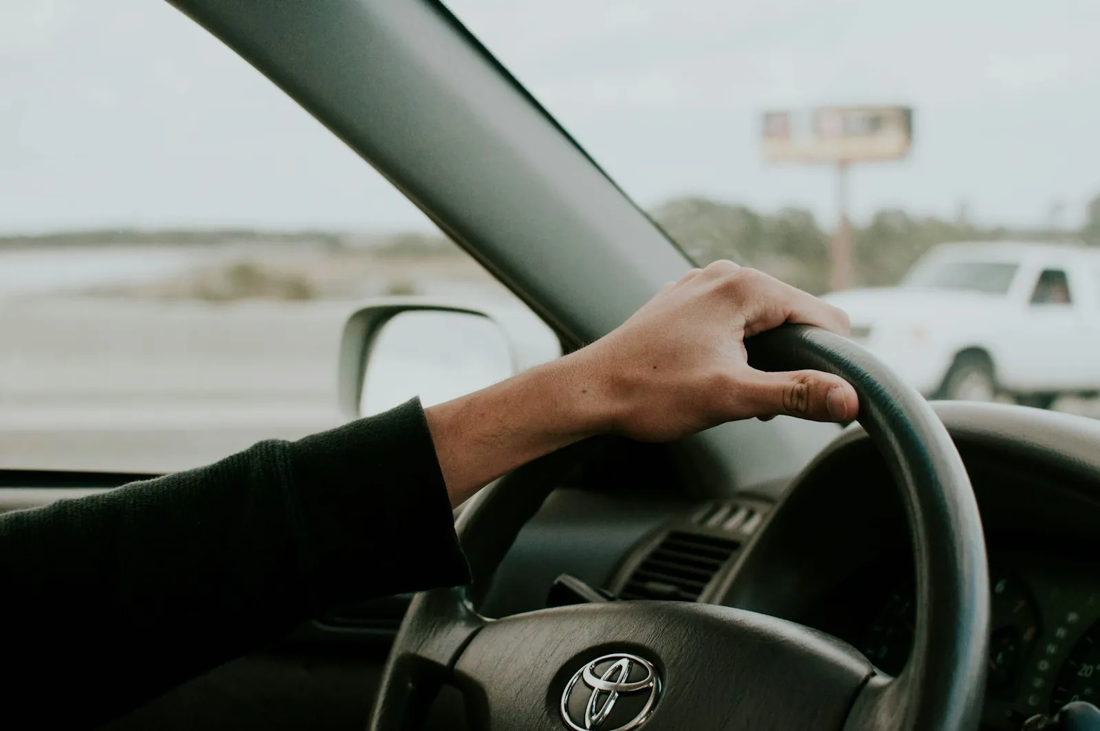 A young driver alone behind the wheel, ready for the test