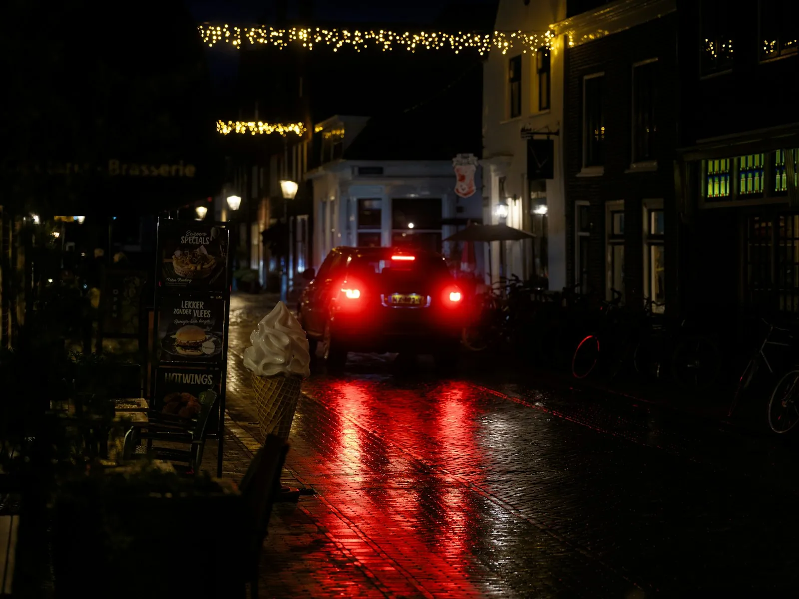 A driver checking a car's brake lights before a driving test
