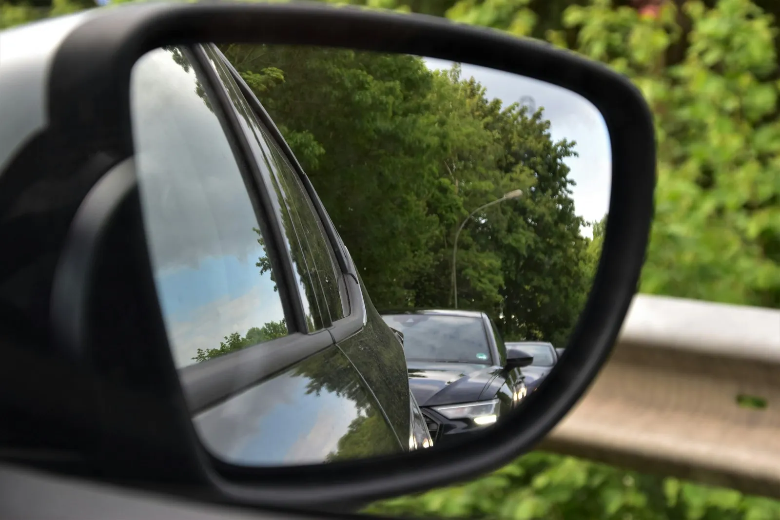 A car signaling as it pulls away from the curb into traffic
