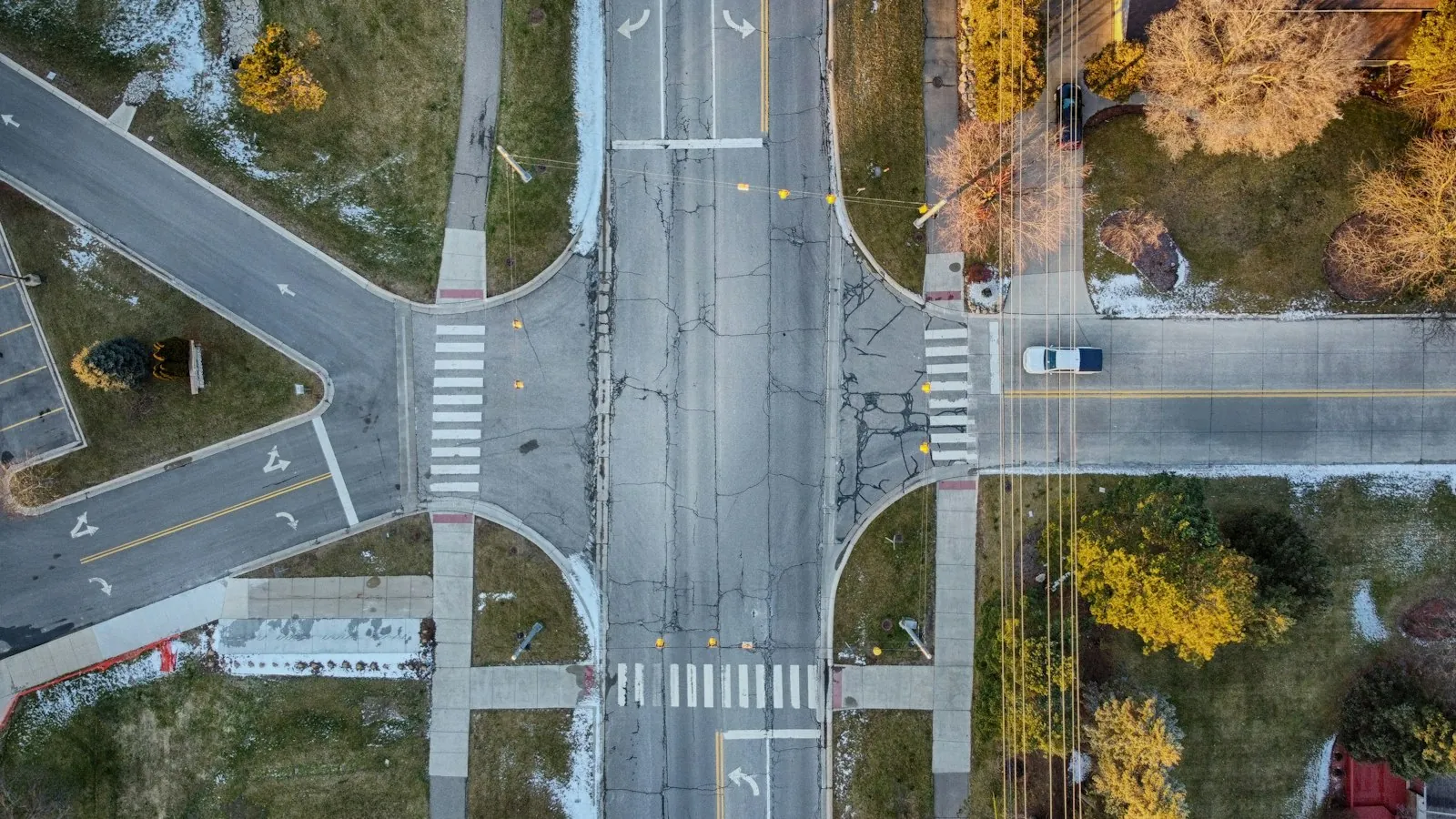 A car making a left turn into the nearest lane at an intersection